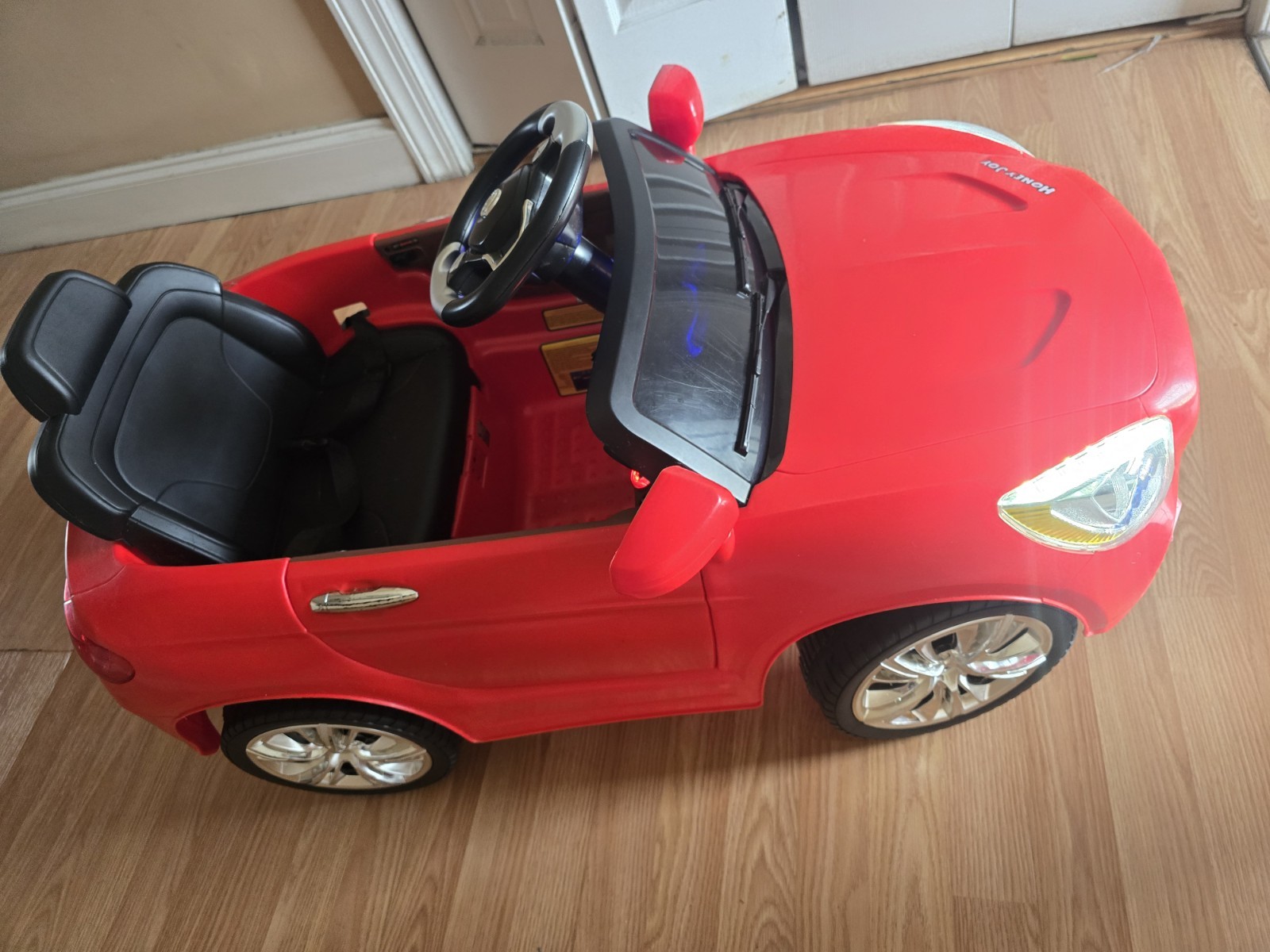 Mercedes-Benz SL65 12V electric ride-on car for children with remote control.