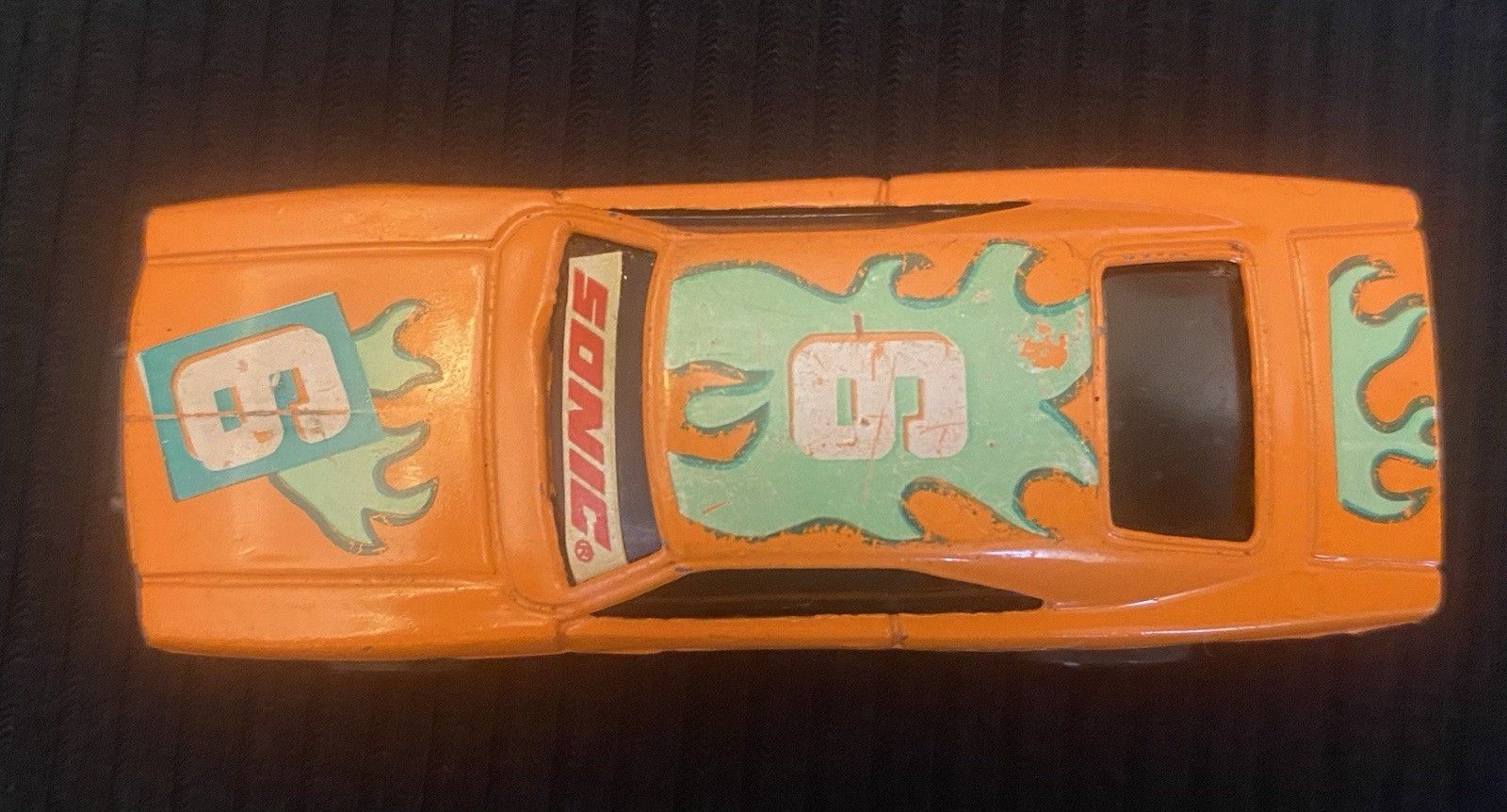Orange Toy Car With Sonic On Windshield And Number 6 On Hood
