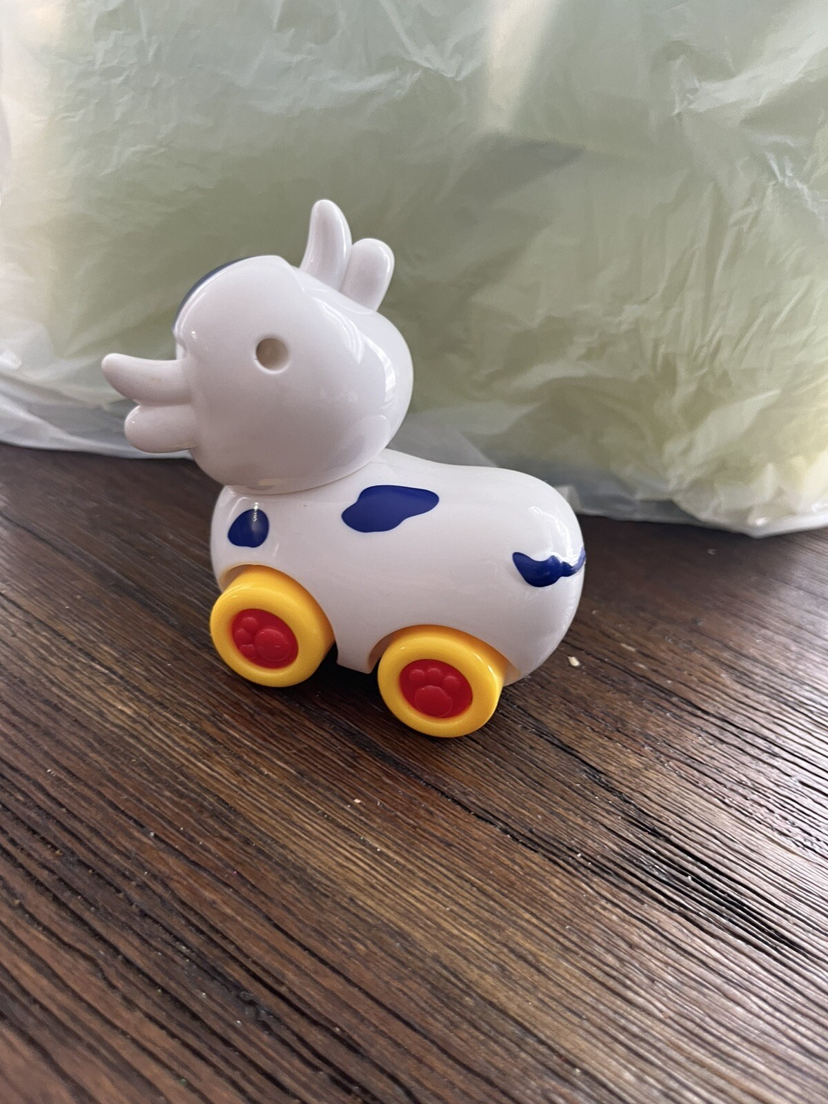 Small Cow on wheels toy with turning head