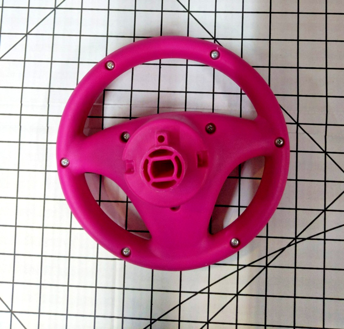 Genuine Kid Trax Corvette Steering Wheel Replacement- Pink with Racing Sticker