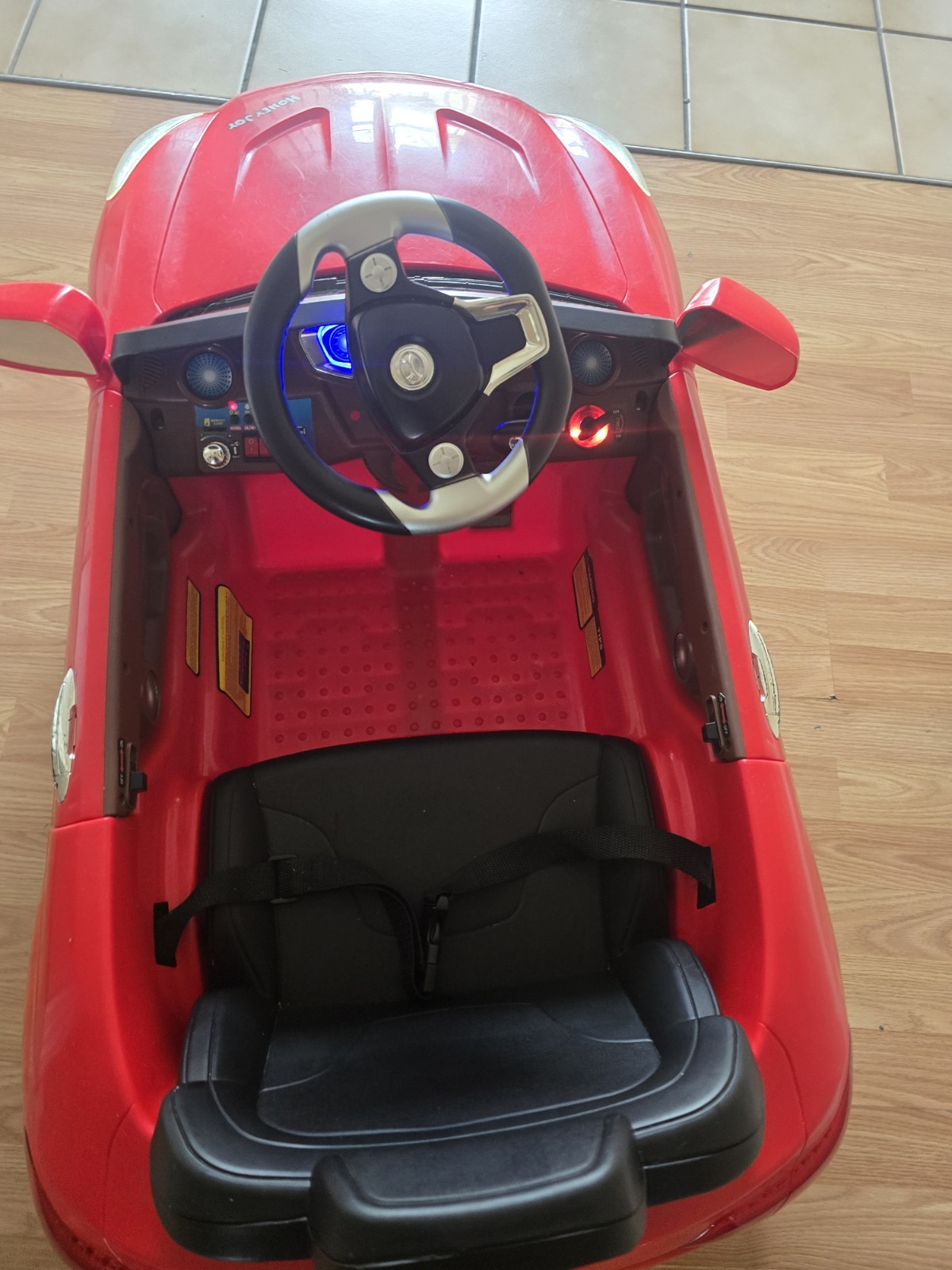 Mercedes-Benz SL65 12V electric ride-on car for children with remote control.