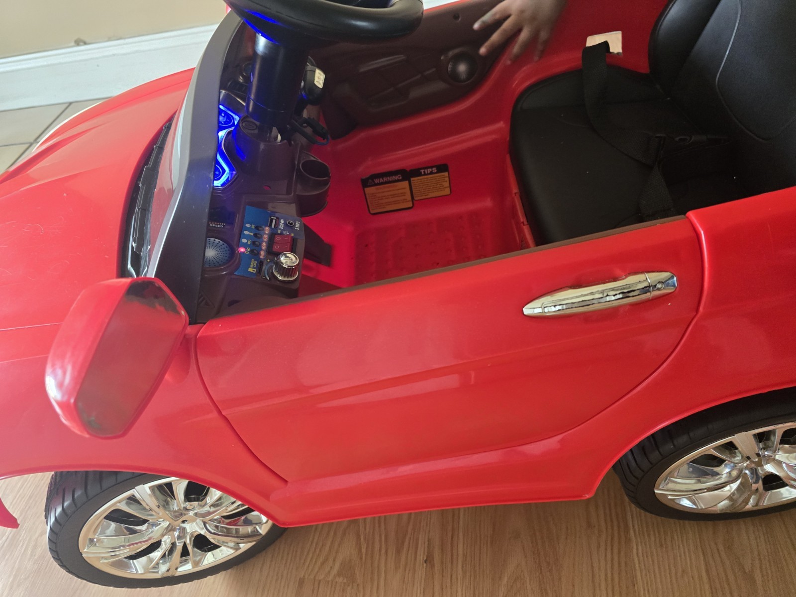 Mercedes-Benz SL65 12V electric ride-on car for children with remote control.