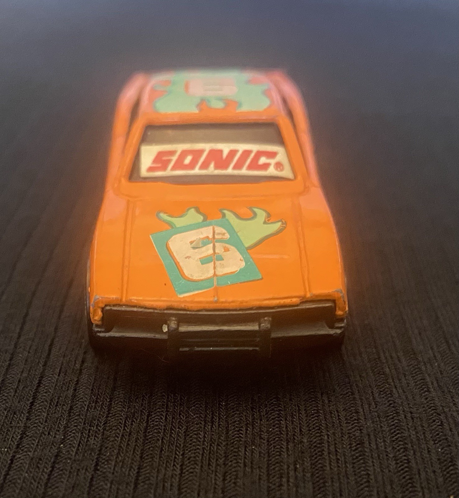 Orange Toy Car With Sonic On Windshield And Number 6 On Hood