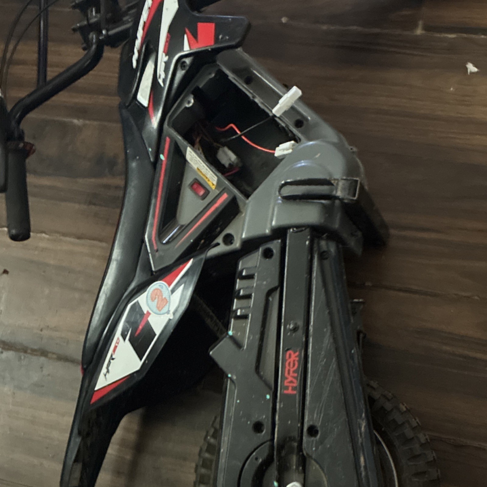Hyper Black/Red/White Battery-Powered Ride-On Dirt Bike Motorcycle