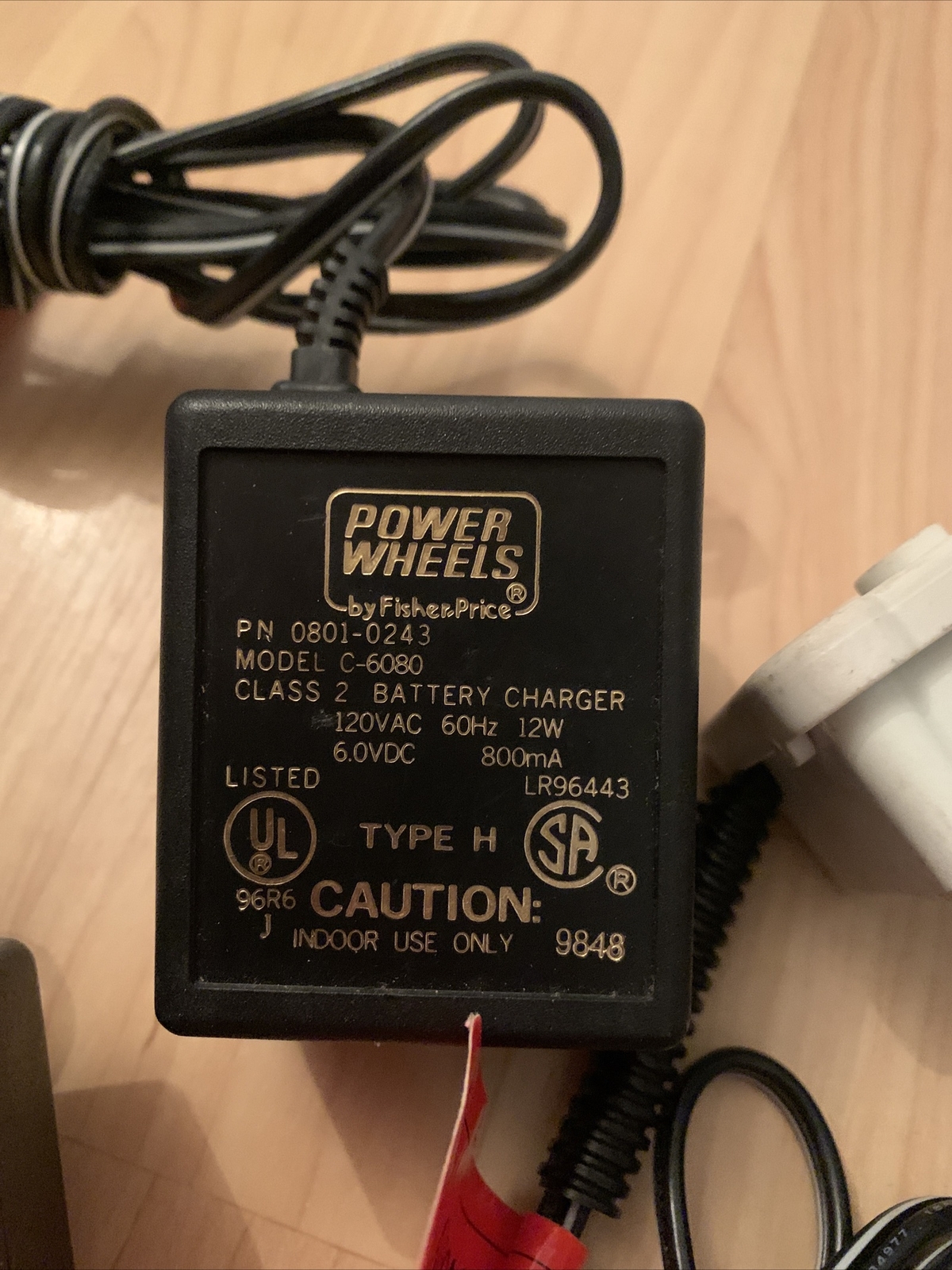 Set of four type H power wheels by Fisher-Price battery chargers