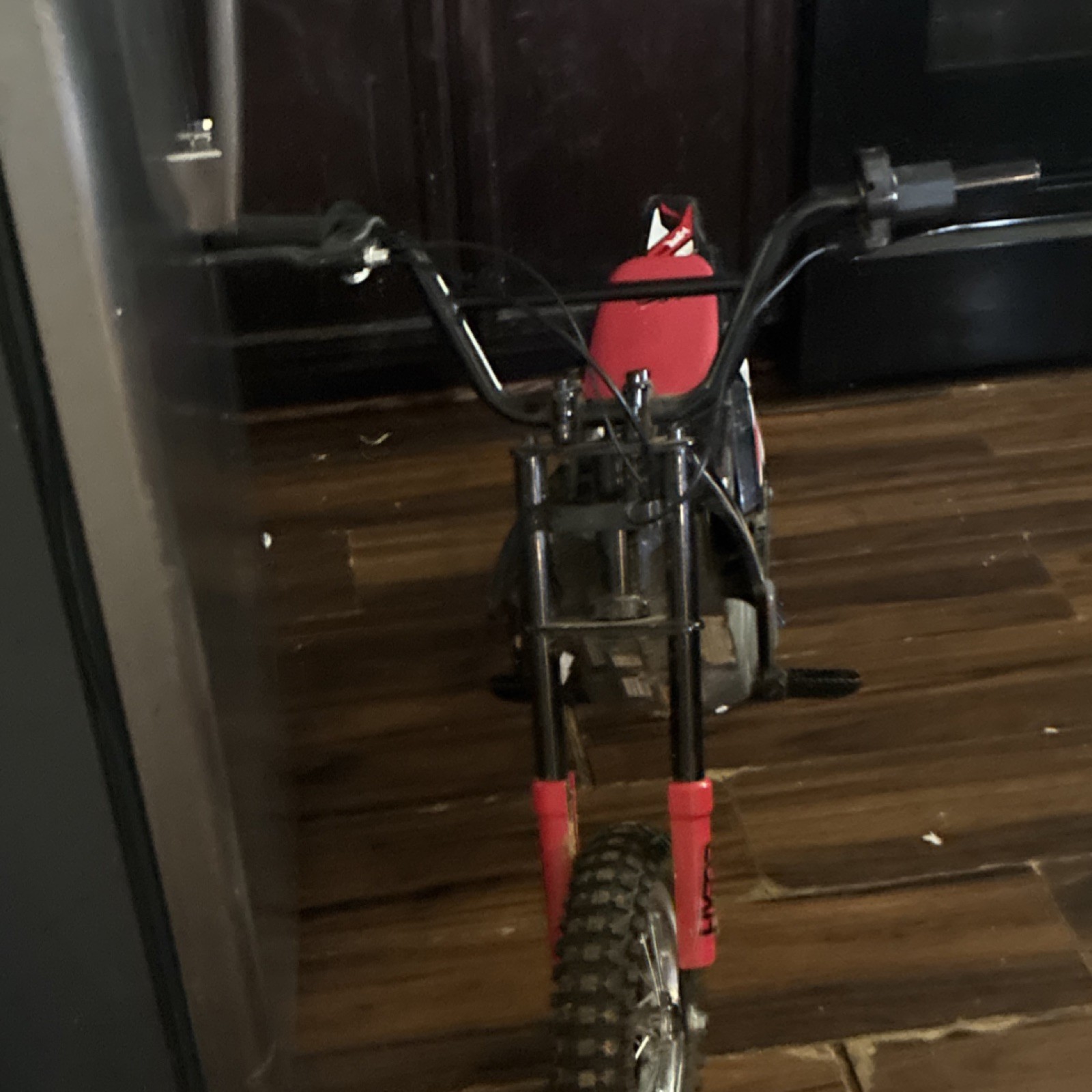 Hyper Black/Red/White Battery-Powered Ride-On Dirt Bike Motorcycle