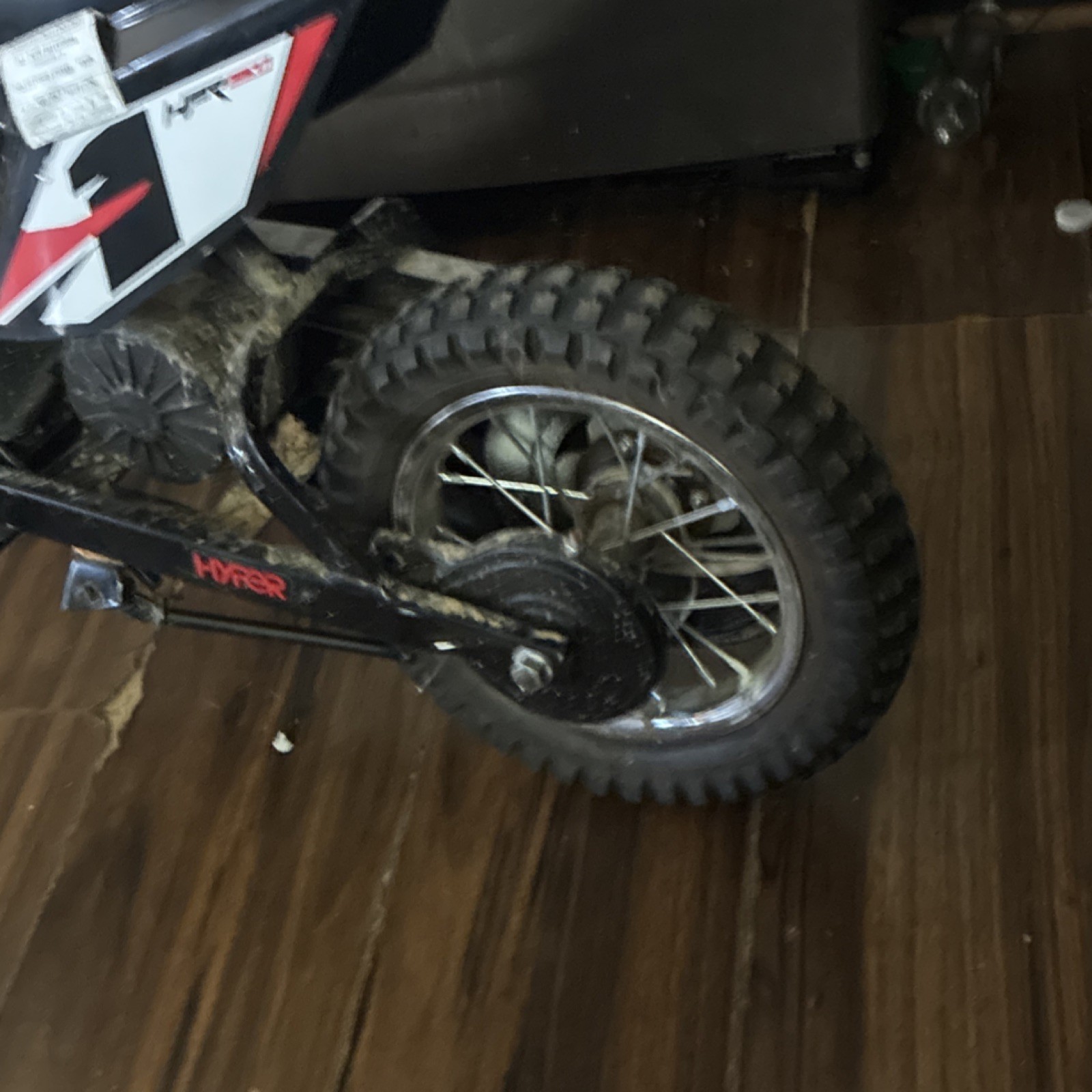 Hyper Black/Red/White Battery-Powered Ride-On Dirt Bike Motorcycle