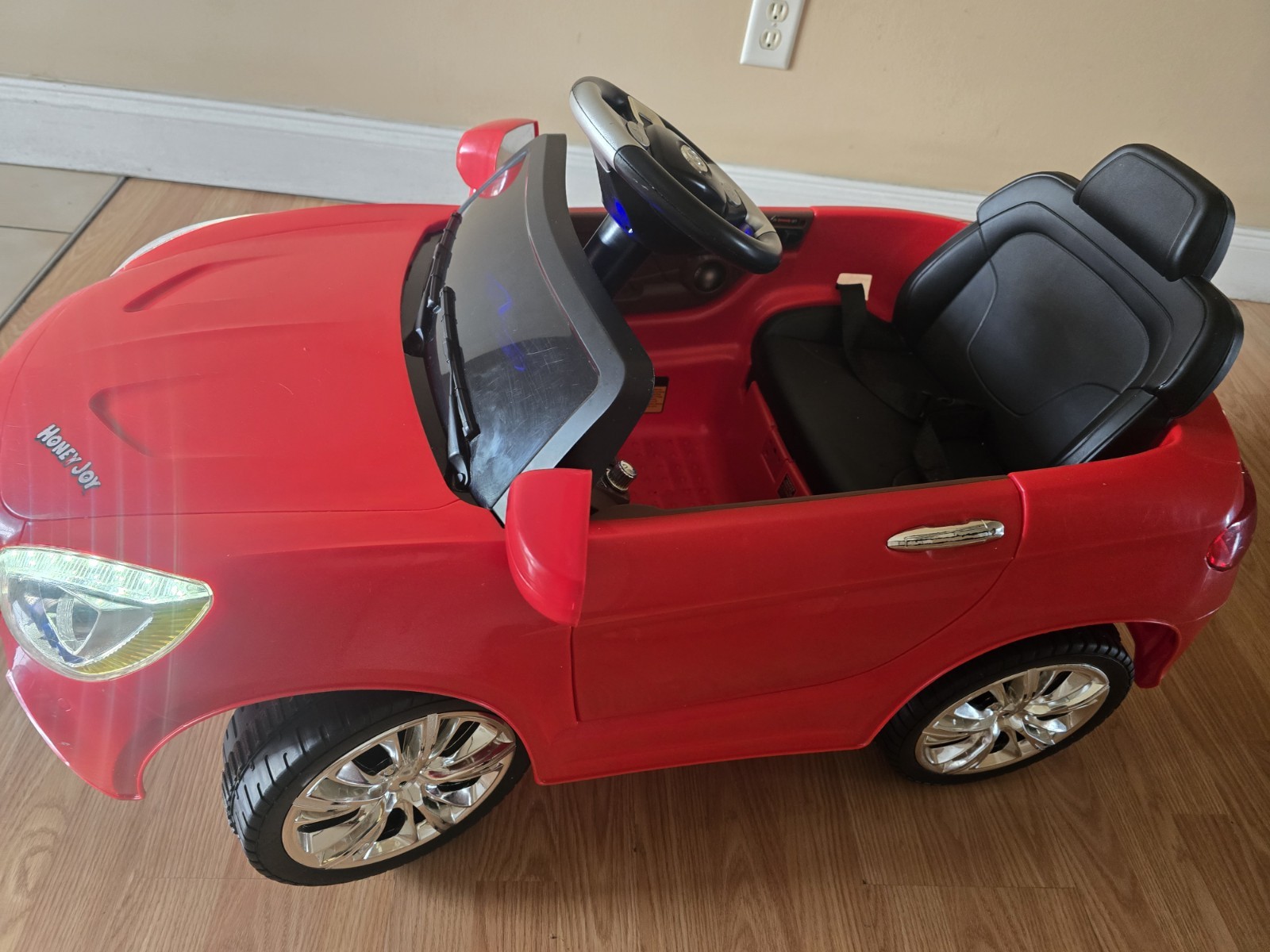 Mercedes-Benz SL65 12V electric ride-on car for children with remote control.