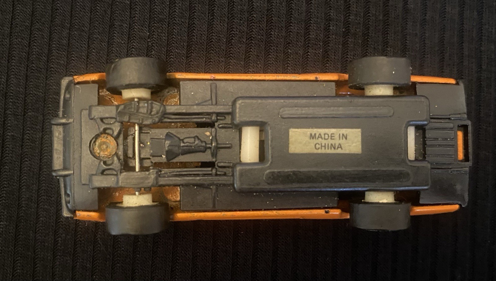 Orange Toy Car With Sonic On Windshield And Number 6 On Hood