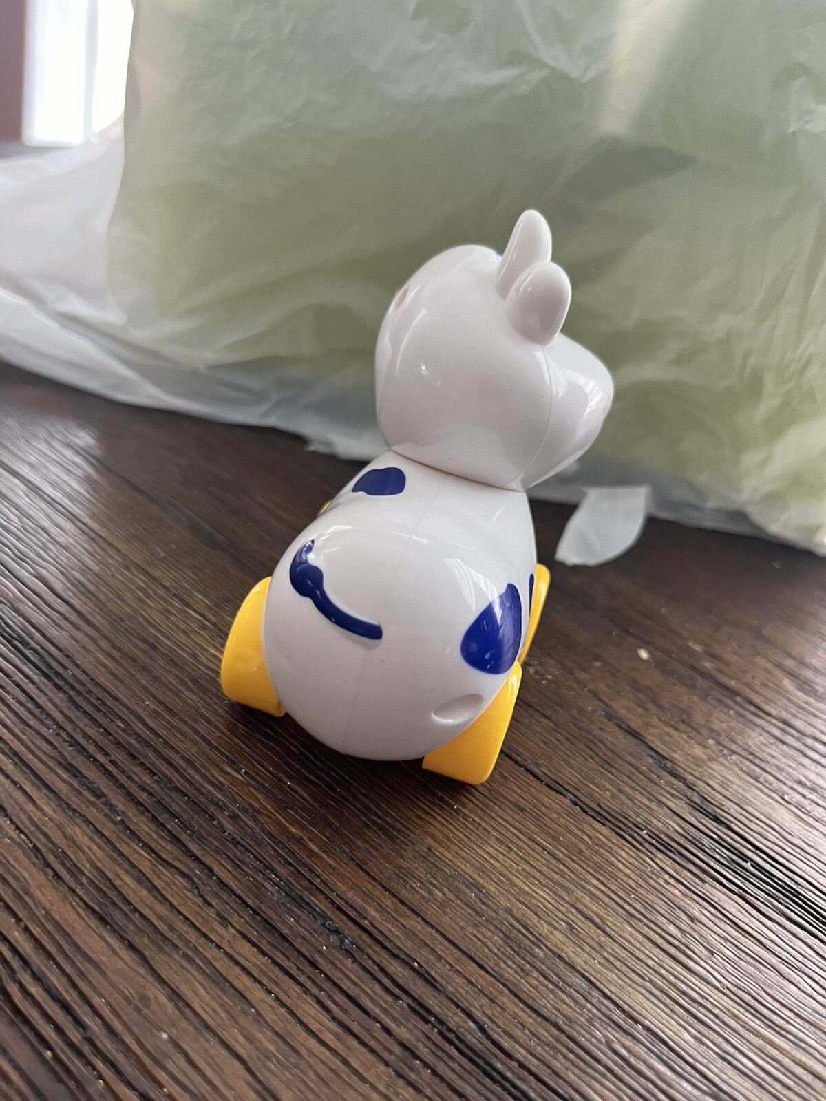 Small Cow on wheels toy with turning head