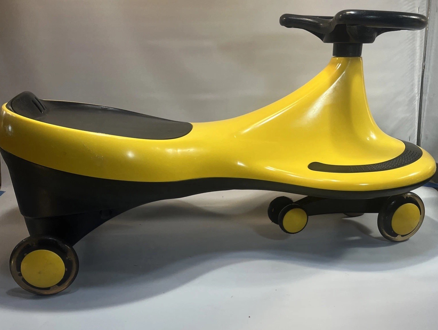 Kids Wiggly Ride-On Yellow Car Toy Light Up Wheels Ride Vehicle