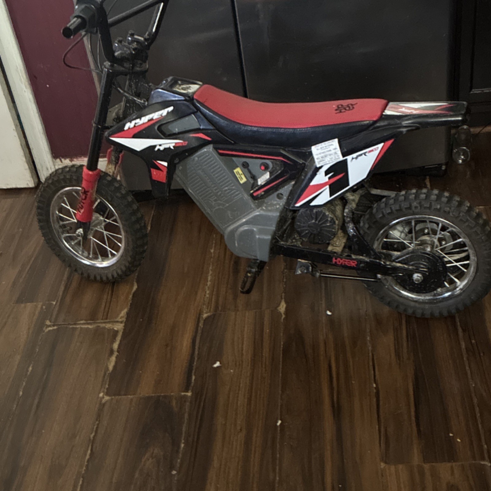Hyper Black/Red/White Battery-Powered Ride-On Dirt Bike Motorcycle