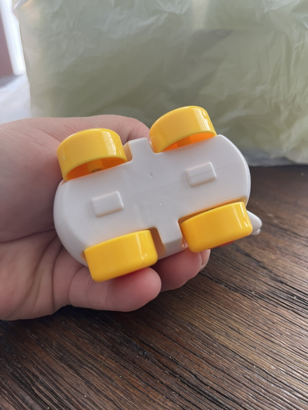 Small Cow on wheels toy with turning head