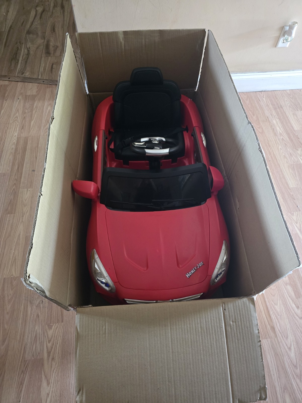 Mercedes-Benz SL65 12V electric ride-on car for children with remote control.
