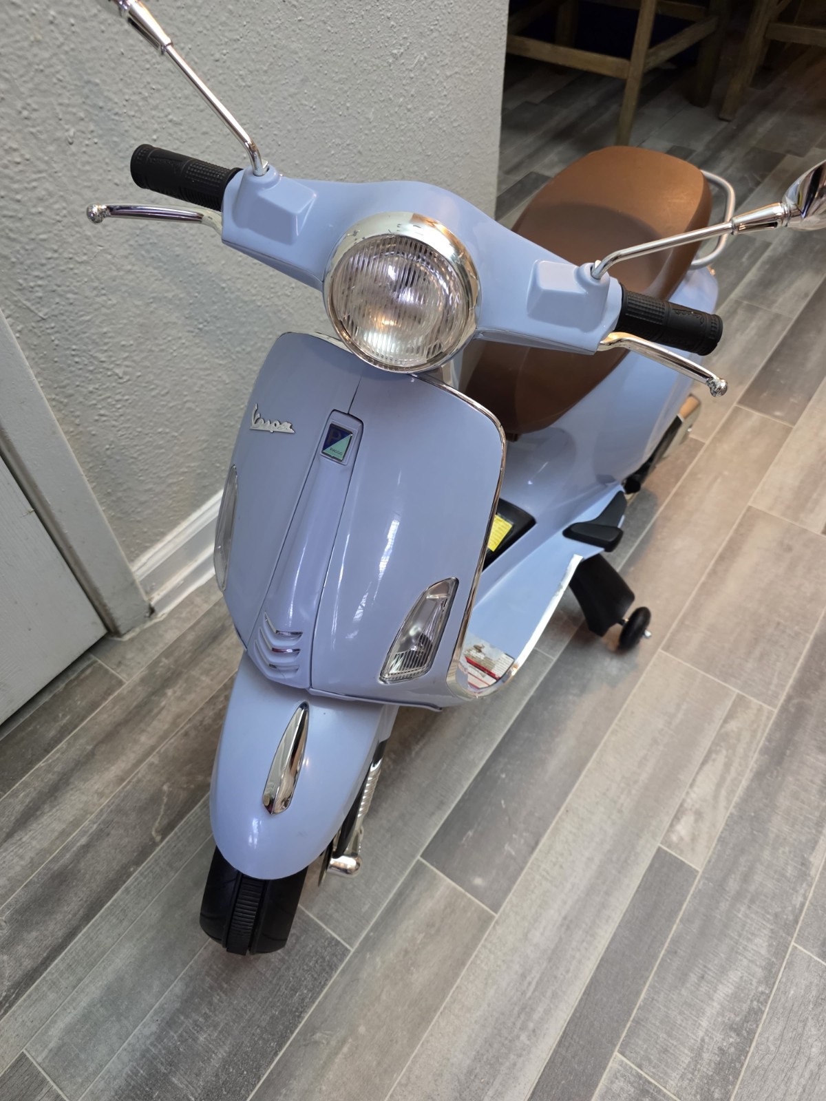 Blazin’ Wheels 12V Vespa GTS Super Sport battery-operated ride-on scooter. Kids